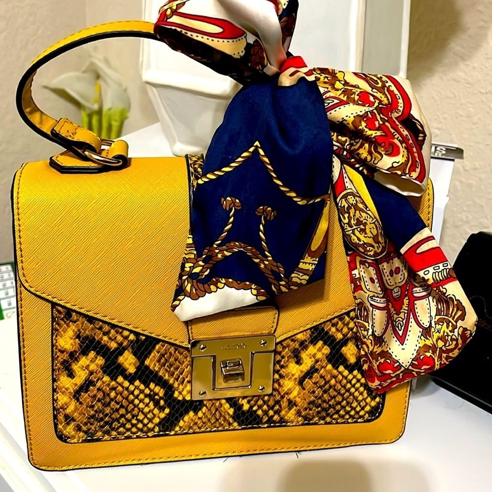 Aldo bag with scarf. Mustard color w/faux snake skin. Comes w/detachable strap